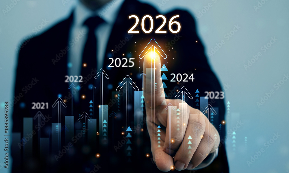 Businessman analyzing financial growth chart for 2026 year.Showing ...