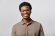© Cristina Garcia - headshot of Young black man smiling in studio portrait
