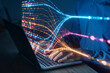 © NicoElNino - Programmer typing on laptop with colorful data flow visualization, concept of artificial intelligence, big data analysis, machine learning, and digital technology innovation
