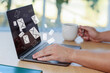 © New Africa - Email notification. Man using laptop at table, closeup. Letters flying out of screen