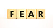 © Dzmitry - Fear symbol. Concept word Fear on beautiful wooden blocks. Beautiful white table white background. Business, lifestyle and fear concept. Copy space.