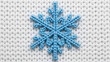 © Umar - Adorable blue snowflake on cozy white knitted fabric evokes winter's charm, perfect for holiday crafts, seasonal designs, and warm festive greetings