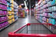© Dewi - Red shopping cart in aisle of brightly lit grocery store with shelves stocked