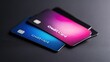 © Virtual Art Studio - Three credit cards with smooth, modern designs in gradient colors of blue, pink, and black are stacked on a dark surface.