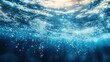 © zong - Underwater view showing clear blue water with a sparkling water surface and rising air bubbles conveying freshness and calmness