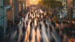 © yusran - Busy urban street scene with blurred figures walking at sunset