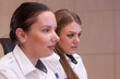© as-artmedia - Two Women Collaborating in Modern Security Control Center