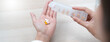 © Pormezz - Healthcare Harmony: Close-Up Hands Holding Medication and Water Glass for Optimal Wellness, Pharmaceutical Treatment and mental health treatment