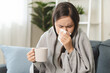 © Pormezz - Women have the flu and a runny nose, and feel sick and cold.