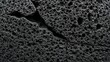 © themondunee - Porous Black Material Close-Up - Abstract Texture and Surface Detail.