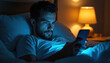 © Maryna - Man in bed at night browses smartphone. Bright screen light illuminates his face. Person has tired and focused expression while scrolling news feed, cannot sleep.