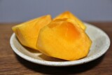 Fresh kaki persimmon fruits purchased at a supermarket in Tokyo, Japan