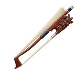 Violin bow with a carved demonic face and horsehair musical instrument string instrument