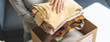 © Pormezz - Organize closet and storage concept, people prepare unwanted old fashion clothes for share donation.