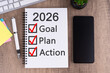 © cn0ra - 2026 goal, plan and action on notepad New Year concept