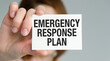 © Pawel - Emergency Response Plan text on card in hand business Women