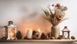 © João Macedo - Burning candles and dry flowers creating cozy winter atmosphere on shelf