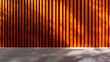 © Raul - Wood slats form a vibrant orange wall next to a light gray tiled floor, accentuated by natural light and shadow patterns.