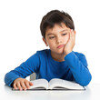 © Creative experience  - Bored child with hand on cheek reading a book with a tired expression isolated on transparent background