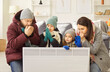 © Studio Romantic - Disappointed family couple, children near heater at home freezing cool flat in warm upper wear, shivering tremble with cold, unhappy people feel bad suffer of heating problems, freezing temperature