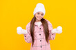 © Olena - happy child in hat and mittens playing snowballs on yellow background, fun