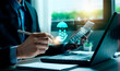 © Sutthiphong - Business professional reviewing digital insurance solutions with holographic protection icons, symbolizing family security, financial safety, modern insurance planning, innovative InsurTech services