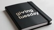 © Alena - A book with 'Giving Tuesday' written on it, perfect for charity events or fundraising campaigns