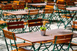 © fottoo - wooden benches and tables at a typical bavarian beergarden