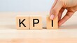 © Ridwan - wooden letter blocks to spell 'KPI' . Ai generated