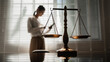 © BuabarnCH - The scales of justice stand in focus while a woman seeks counsel, symbolizing the legal protection of women's rights, gender equality, safety from domestic violence, and the pursuit of fair justice.