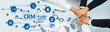 © InfiniteFlow - A dynamic image showcasing hands joining together over CRM concepts, featuring analytical graphs and icons that emphasize customer management and business strategies. Amity