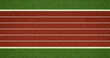 © natrot - Top view of red running track lanes with white markings bordered by green field surface, suitable for athletics themes, sports design materials, fitness visuals and training-related concepts.