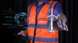 © PRIM - Engineer touching virtual wind turbine hologram. Sustainable renewable energy technology and green power generation concept for future industrial environment and clean electricity.