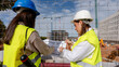 © ADDICTIVE STOCK - Architect and engineer collaborating on construction site