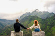 © ADDICTIVE STOCK - Couple admiring mountain view in Madeira, Portugal