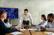 © Prostock-studio - In a contemporary office, a young CEO speaks aggressively to his team about business failures. Employees appear upset, reflecting the tense atmosphere during the meeting.