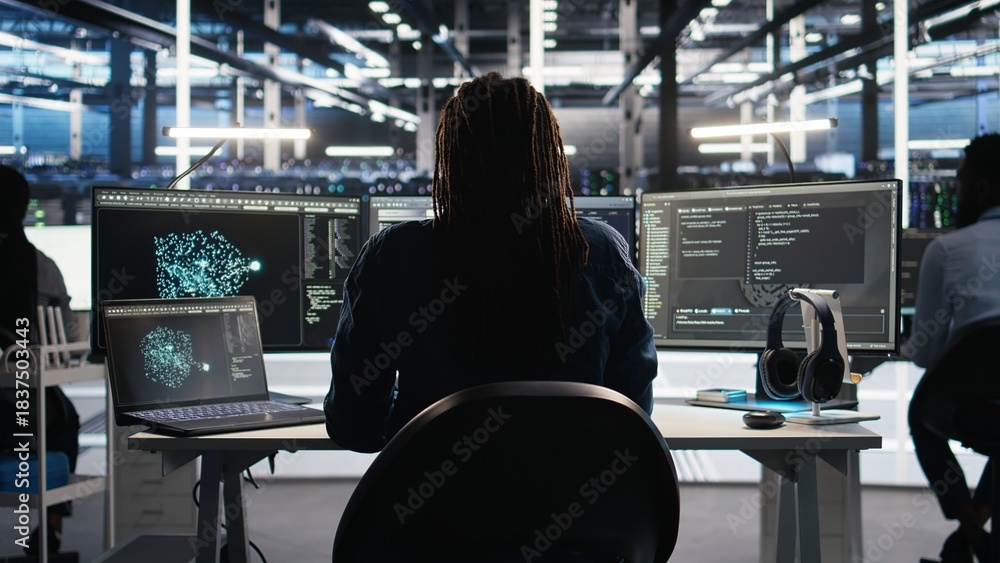 Irritated data center engineer punching desk, irked by glitches while ...