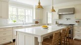 Interior design of a beautiful kitchen featuring a large island, bright cabinetry, and elegant finishes inside a modern colonial home