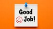 © PIXEL BOY - Good job message with smiley face pinned on bright orange background for recognition and positive feedback