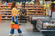 © Serhii - Young woman shopping for healthy food in supermarket