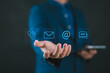 © Nirusmee - Hand displaying contact icons (address, phone, email, call), representing customer support, digital communication, and modern business contact services in the “Contact Us” concept.