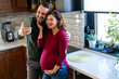 © NDABCREATIVITY - Couple with pregnant woman make video call, taking selfie, spend leisure at home enjoy modern tech