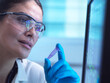 © BusinessClass by W61 - Scientist analyzing DNA sample with monitor in laboratory