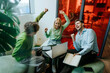 © BusinessClass by W61 - Business colleagues celebrating success together in modern office