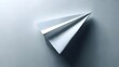 © ARDNETWORK - A perfectly folded white paper airplane rests on a sleek surface, symbolizing the purity of imagination, the freedom of new ideas, and the hopeful journey of communication taking flight