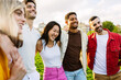 © Xavier Lorenzo - Young group of diverse friends having fun in a sunny day at city park. Multiracial best friends enjoying time together outdoors. Youth community concept