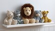 © Nataliia_Trushchenko - Collection of plush toys including a lion, bear, zebra, and pig, arranged on a white shelf against a light wall, creating a cozy and playful atmosphere for children's decor