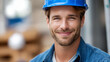 © Denis Yevtekhov - Faceless portrait of happy smiling confident construction worker, professional tradesperson, industrial site employee, positive attitude worker, safety equipment visible, defocused