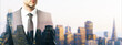 © Who is Danny - Businessman in suit with double exposure of city skyline at dusk, symbolizing urban innovation and corporate ambition through creative overlay.