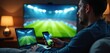© miss irine - Man watches football game on TV laptop and phone. He is engaged with sports event using multiple devices. Indoors at home enjoying live match streaming on big screen and checking stats.
